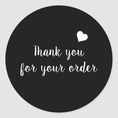 thank you for your order sticker with a heart in the center on a black background