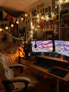 two computer monitors sitting next to each other on top of a desk in a room