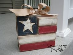 an american flag box with a bow on top