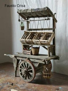 an old wooden cart with baskets on it