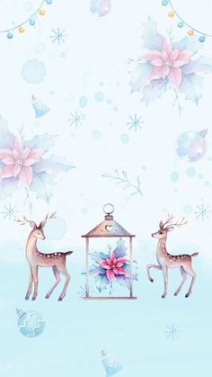 two deer standing next to each other in front of a bird feeder with flowers on it