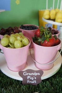 a plate with three buckets filled with fruit on top of it, and the caption reads grandma pig's fruit