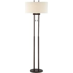 a floor lamp with a white shade on the top and a black base, in front of a white background