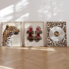 three framed pictures with leopard print and red high heels on them in front of a white wall