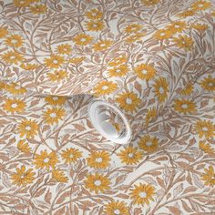 an orange and white floral wallpaper with yellow flowers on the outside, in front of a beige background