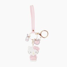 a hello kitty keychain hanging from a pink strap