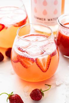 strawberry rose spritzer in glasses with ice and strawberries