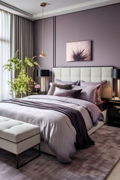 a bedroom with purple walls and white bedding