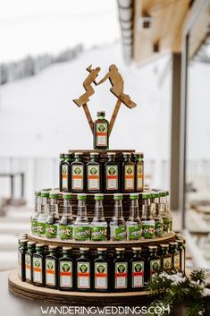 a wedding cake made out of beer bottles