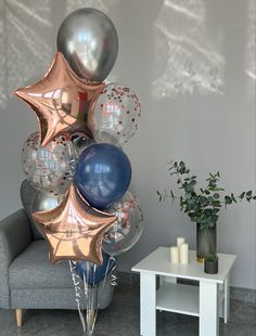 a bunch of balloons that are sitting on a chair