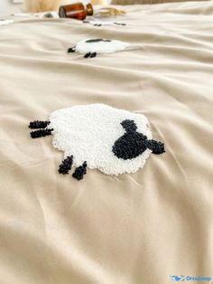 a sheep rug is laying on the bed