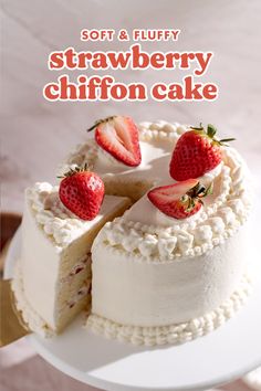 a white cake with strawberries on top and the words soft & fluffy strawberry chiffon cake