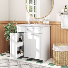 a bathroom with a sink and mirror in it