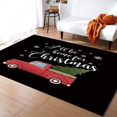 a living room area rug with a red car and christmas tree on the back ground