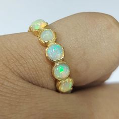 -PRODUCT TYPE - GOLD VERMEIL ETHIOPIAN OPAL RING -MATERIAL - SILVER -PURITY - 925 -TOTAL WEIGHT - 5.500 GRAMS - SILVER WEIGHT - 4.400 GRAMS - STONE WEIGHT - 5.50 CARAT - STONE SIZE - 4.5 MM 18K Yellow Gold Vermeil Ethiopian Opal Ring: Minimal & Simple, Dainty Handmade Yellow Gold Vermeil Bands. Rustic, Understated Luxury. - Delicate Handmade Yellow gold Vermeil ring. - Made to order, just for you. Anirudh Gems Store :- https://www.etsy.com/uk/shop/ANIRUDHGEMSStore?ref=search_shop_redirect We Adjustable Gold Opal Ring Fine Jewelry, Gold Opal Stackable Ring With Oval Shape, Gold Stackable Opal Promise Ring, Gold Spiritual Rings With Bezel Setting, Spiritual Gold Rings With Bezel Setting, Gold Adjustable Opal Ring, Round Shape, Gold Opal Ring Adjustable, Adjustable Gold Opal Ring, Gold Stackable Opal Ring Gift