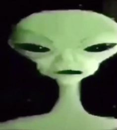 an alien with green eyes and black hair