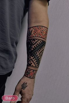 a man with a tattoo on his arm