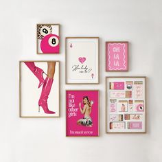 pink and white wall decor with pictures on the wall, including framed photos and posters