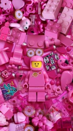 a pile of pink legos that are all over the place