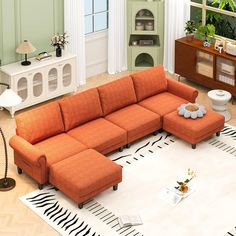 an orange sectional sofa in a living room