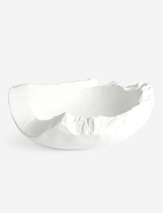 a white bowl sitting on top of a table