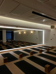 an empty room with black and white striped flooring