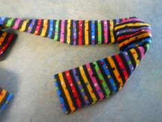 two colorful hair ties laying on top of each other