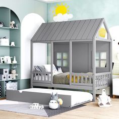 a child's bedroom with two beds and a house shaped bed in the middle