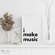 there are two vases with plants in them on the shelf next to an i make music poster