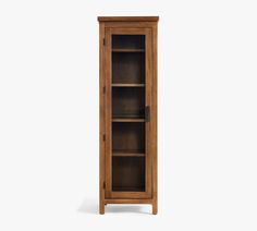 an oak bookcase with glass doors on the front and bottom shelves, against a white background