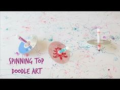 two toothbrushes sitting on top of a table with sprinkles around them