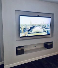 a flat screen tv mounted to the side of a wall