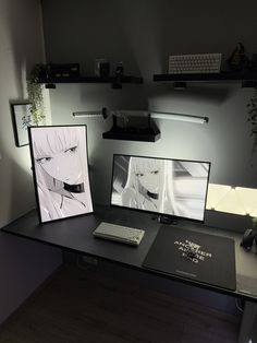 two computer screens sitting on top of a desk