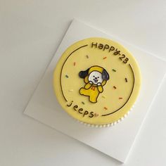 a yellow birthday cake with a dog on it