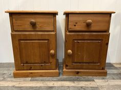 two wooden nightstands side by side with knobs