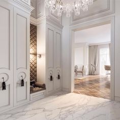 an elegant white room with chandelier and marble floors