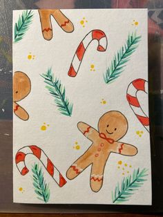 a christmas card with gingerbreads and candy canes