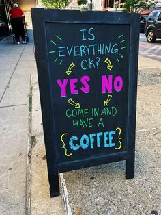 a sign on the sidewalk that says is everything ok? yes no come in and have a coffee