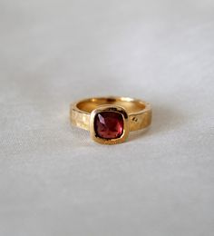 D E T A I L S - Stone: Garnet Stone Shape: Pyramid Material: Sterling silver The fit: True to US ring size Finish: Hammered and Gold Plated to a high shine S H I P P I N G & P R O D U C T I O N - My current production time is 2-6 business days, which means after those days are up, your order ships! I make everything custom to order, by hand, but I promise you it's worth the wait! R U S H - M Y - O R D E R - If you're in a rush to get your pretty new pieces, please send me a message and I'll Heirloom Topaz Ring With Bezel Setting For Gift, Heirloom Style Topaz Ring With Bezel Setting As Gift, Heirloom Style Topaz Ring With Bezel Setting, Blue Topaz Ring For Gift, Sally Mcqueen, Garnet Birthstone Rings, Vintage Garnet Ring, Garnet Ring Vintage, Handmade Gold Ring