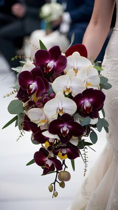 Mahogany and Champagne Orchids: Luxurious Fall Wedding Bouquets Fall Wedding Flower Bouquets, Wedding Bouquet Orchids, Orchids Bouquet, Fall Orchid Arrangement, Purple Cascading Wedding Bouquets, Plum Bridal Bouquet Fall, Purple Cascade Wedding Bouquet, Autumn Cascade Bouquet, Purple Orchid Bouquet