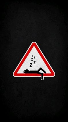 a red and white triangle sign with a sleeping man underneath it on a black background