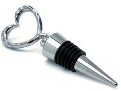 a heart shaped bottle stopper with a black rubber band on the bottom and a silver handle