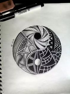 a drawing of a spiral design on paper