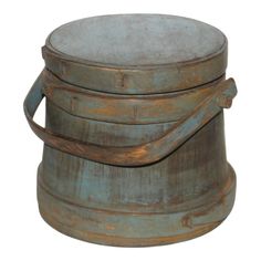 an old metal bucket is stacked on top of each other