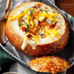 a bread bowl filled with cheese and meat