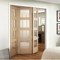 an open wooden door in a white room