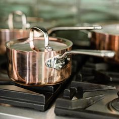 pots and pans are sitting on the stove top