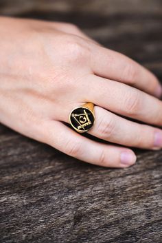 "Black enamel masonic symbol engraved signet ring ♡ very delicately handcrafted unisex - looks super cool on both women & men face size: 15x17 mm side or inside engravings cost 12 USD for both sides.  please contact us if you request side engravins or simply go back to our shop and purchase the \"Side or inside engraving fee\" listing. material options:  9k solid gold 14k solid gold 14k solid rose gold 14k solid white gold 18k solid gold 18k solid rose gold 18k solid white gold 925 sterling silver 14k gold plated rose gold plated what is gold/rose gold plated: gold/rose gold plated is genuine 925 sterling silver that has been expertly plated with a thick layer of 14k gold/rose gold shipping: ♡ all our listings include free expedited shipping delivers in 2-4 business days size: we offer siz Adjustable Black Symbolic Signet Ring, Free Mason Ring, Lost Symbol, Masonic Rings Jewelry For Men, Masonic Symbols Freemasonry, Mason Ring, Masonic Apparel, Masonic Symbol, Engraved Signet Ring