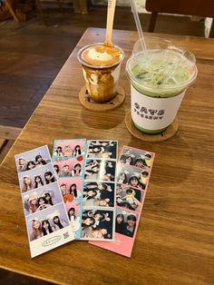 an ice cream sundae and some photos on a wooden table with a straw in it