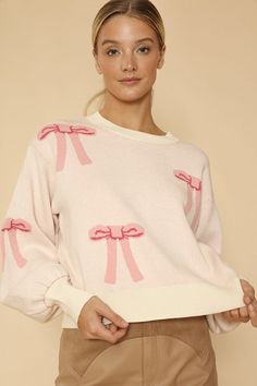 *In-House Design*-Bow intarsia all over-Round neckline-All original design Winter Pink Knit Tops, Pink Knit Top For Winter, Pink Knit Top For Spring, Crew Neck Jacquard Knit Sweatshirt For Spring, Cream Jacquard Knit Tops For Spring, Pink Knit Winter Top, Trendy Jacquard Knit Sweater For Spring, Pink Textured Knit Top For Winter, Fitted Pink Sweatshirt For Spring